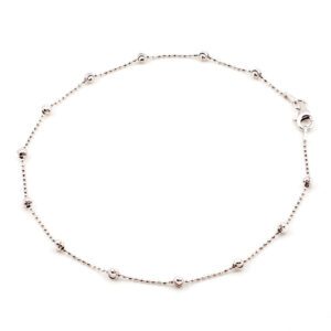 A Thin Silver Bracelet With Ball Detailing