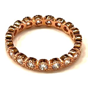 a gold ring with diamonds