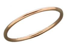 A Brass Color Bangle Bracelet on a White Background